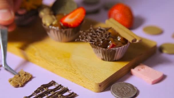 The decoration of chocolate tartlets - Footage, Video