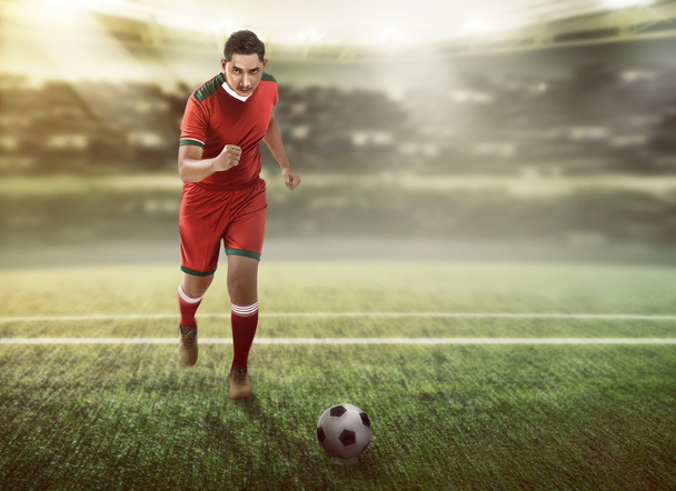 Football player dribbling ball - Photo, image