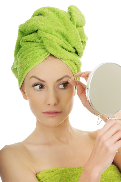 Beautiful woman with a mirror. - Foto, Bild