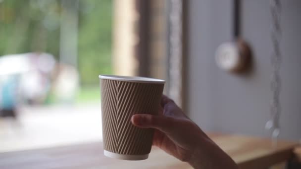 Woman drinking coffee in restaurant or cafe - Кадри, відео