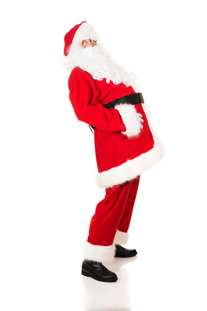 Full length Santa Claus grabbing his belly - Photo, Image