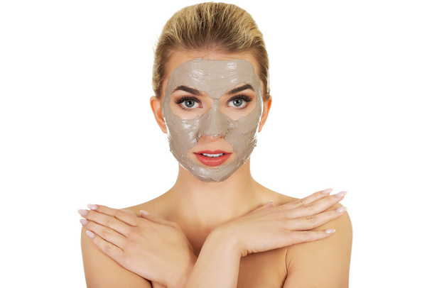 Young  woman with facial mask - Foto, afbeelding