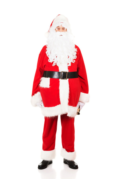 Full length Santa Claus holding a bell - Zdjęcie, obraz
