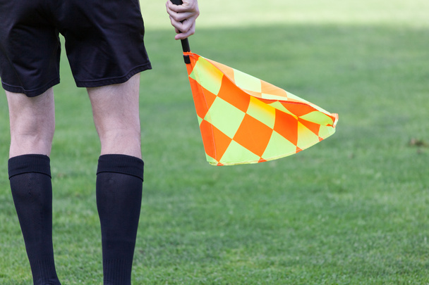 Assistant referees in action during a soccer match - Photo, Image