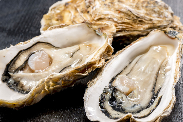 Raw oysters of seafood is very fresh and delicious food - Photo, Image