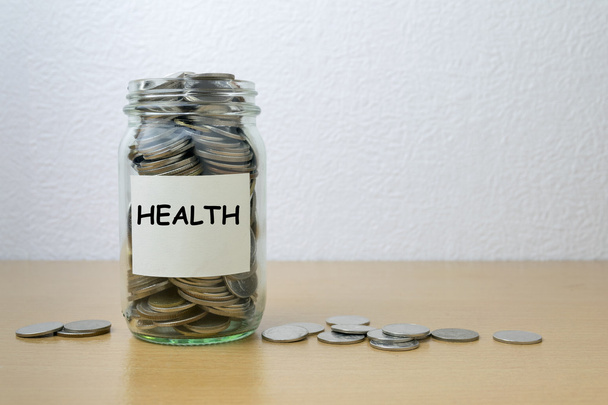 Money saving for health in the glass bottle  - Photo, Image