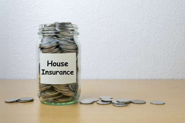 Money saving for house Insurance in the glass bottle  - Photo, Image