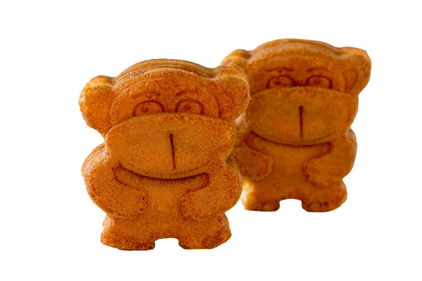 Kekse mit Füllung (Milchkaramell) in Form eines Affen, ist - Foto, Bild