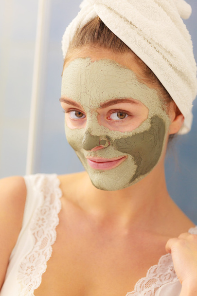 Woman face with green clay mud mask  - Fotó, kép