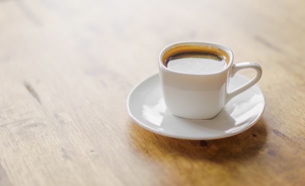 Coffee cup on wooden table  - Fotó, kép