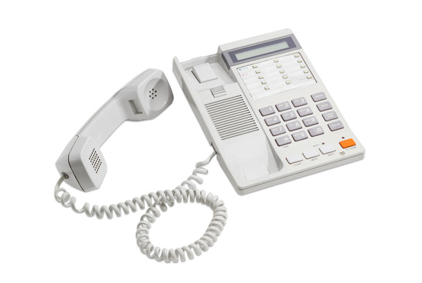Σταθερό τηλέφωνο με καντράν πάτημα κουμπιού σε ελαφρύ φόντο - Φωτογραφία, εικόνα