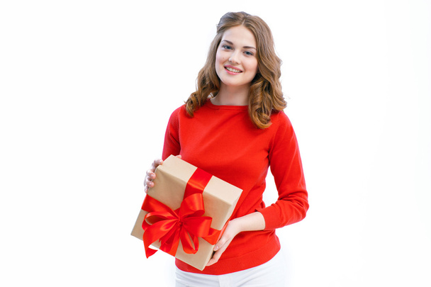 Joyful woman holding a box with gift - Foto, Bild