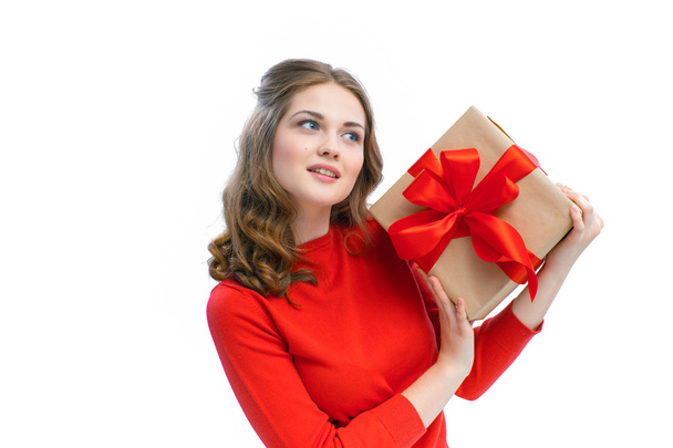Joyful woman holding a box with gift - 写真・画像