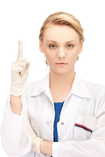 Naislääkäri sormi ylöspäin
 - Valokuva, kuva