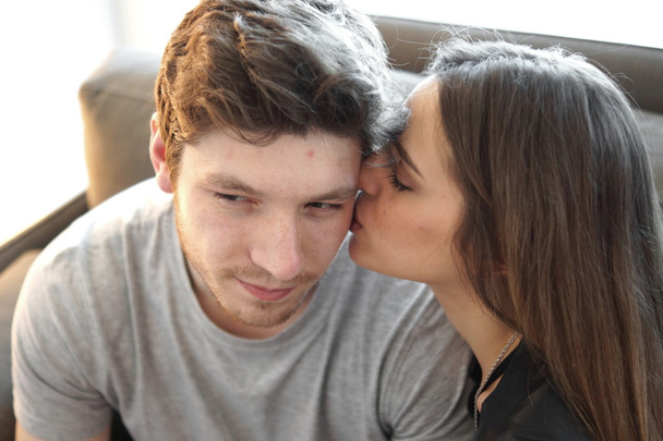 Shot of a kissing couple of young people  - Foto, afbeelding