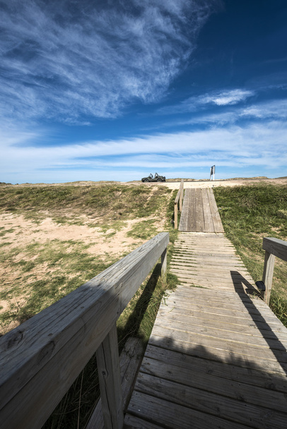 Wooden walkway across the beach on the Uruguayan eco-lake Garzon - Photo, Image