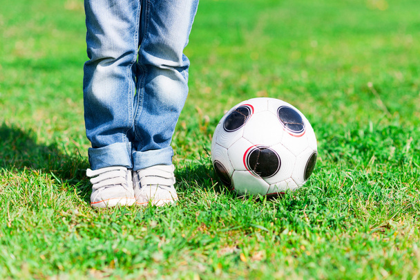 Cute small male child playing football game - Foto, Imagem