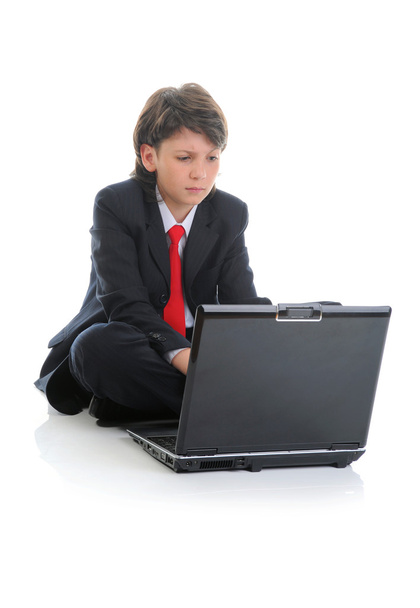 Boy in business suit sitting in front of computer - Foto, imagen