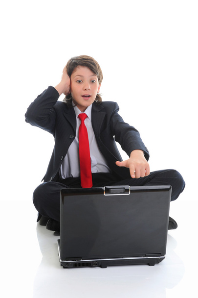 Boy in business suit sitting in front of computer - Zdjęcie, obraz