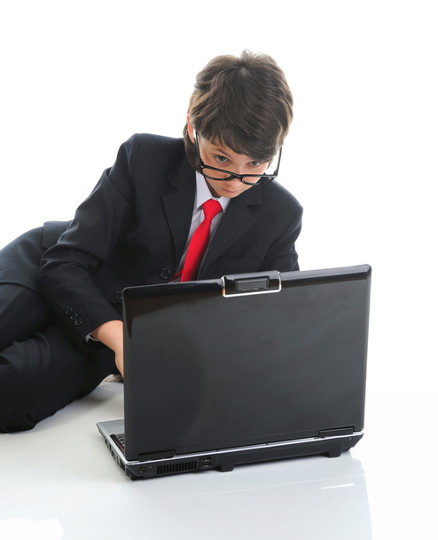 Boy in business suit sitting in front of computer - Фото, изображение