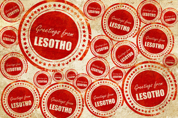 Greetings from lesotho, red stamp on a grunge paper texture - Foto, imagen