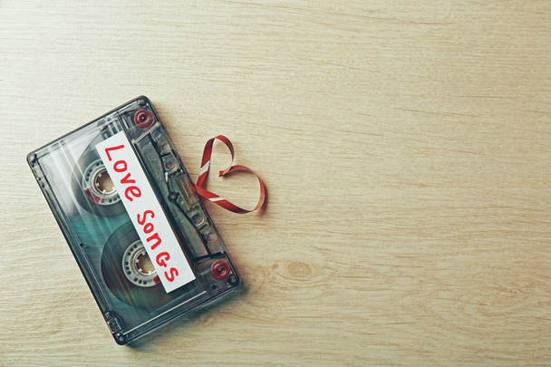 Retro audio cassette with tape in shape of heart - Foto, Imagem