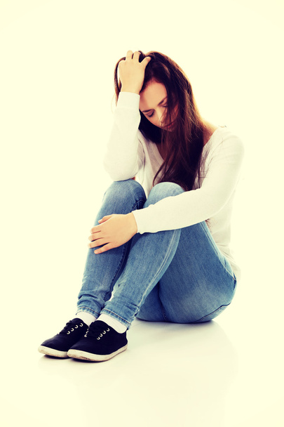 Young depression woman sitting on the floor - Zdjęcie, obraz