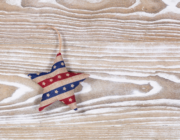 Stuffed star in USA traditional colors on white wooden boards   - Photo, Image
