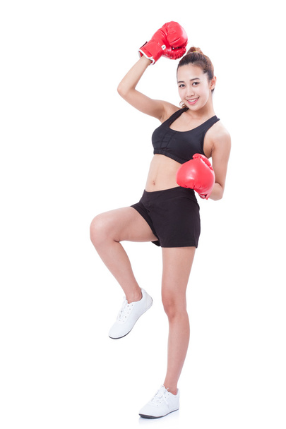 Boxer - Full length fitness woman boxing wearing boxing red gloves on white background. - Foto, immagini