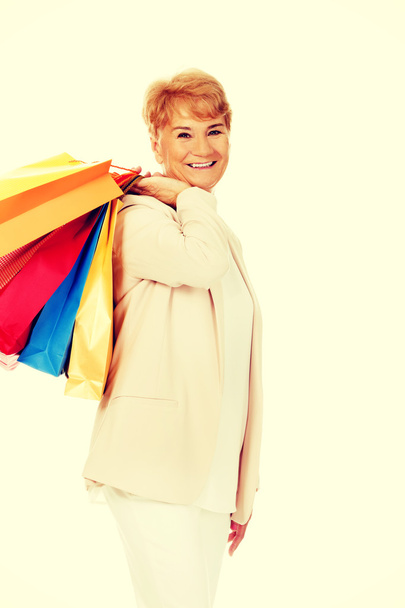 Happy business woman holging shopping bags - Zdjęcie, obraz
