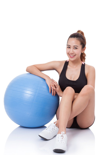 Young woman doing exercises with fitness ball. - Фото, изображение