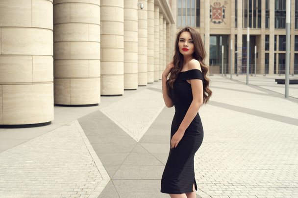 Pretty beautiful business woman in elegant black dress - Fotoğraf, Görsel
