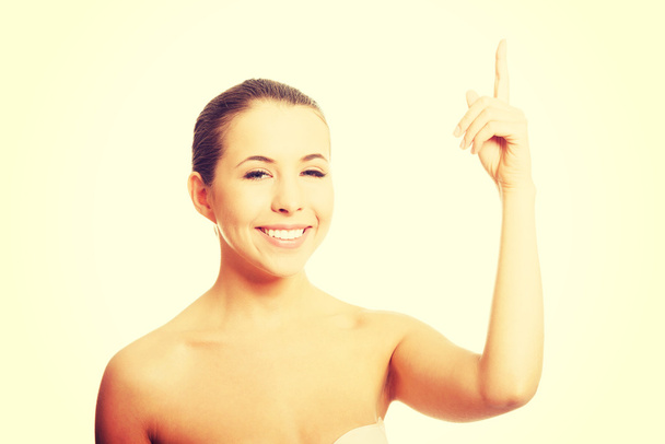 Nude woman pointing up - Fotografie, Obrázek