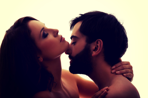 Caucasian man kissing womans neck. - Photo, Image