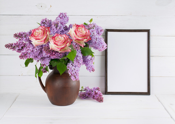Lilac bouquet with roses in jug with motivational frame - Photo, Image