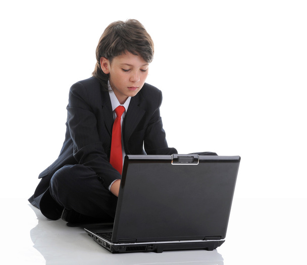 Boy in business suit sitting in front of computer - Photo, Image