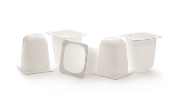 Empty crushed plastic yogurt pots - Photo, Image