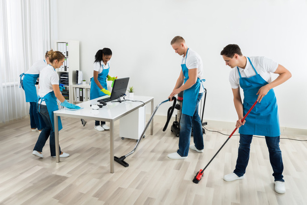 Group Of Janitors Cleaning The Office - Valokuva, kuva