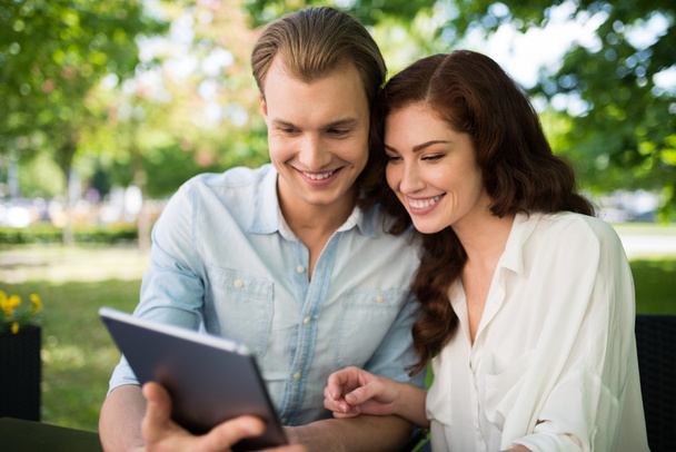 Happy couple using a tablet - 写真・画像