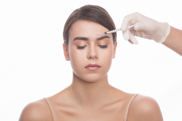 Mulher recebendo injeções faciais de beleza
 - Foto, Imagem