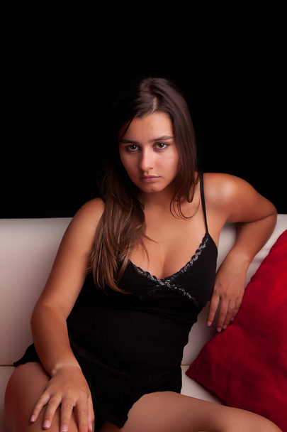 Young woman relaxing on couch - Fotó, kép