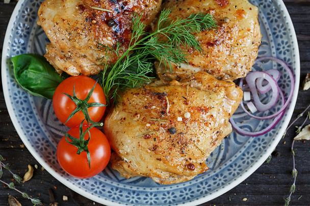 Roasted chicken and vegetables on dark wooden background - 写真・画像