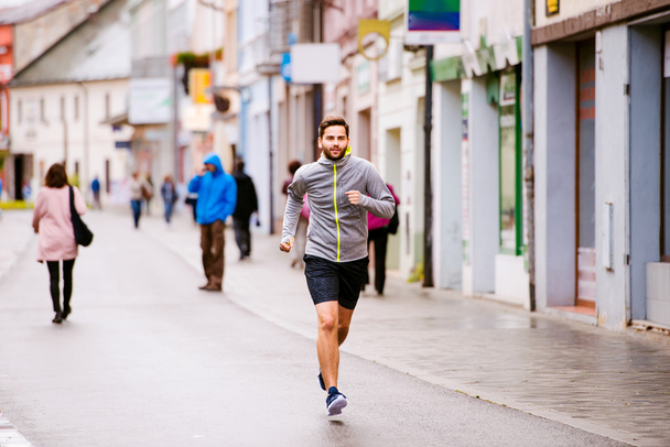 Young hipster man running in town  - Foto, imagen