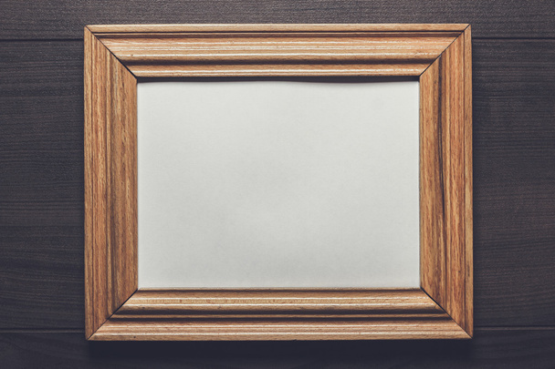 old empty frame on wooden wall - Foto, Imagen