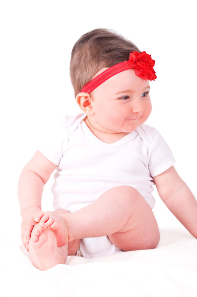 Baby girl with red ribbon.  - Photo, Image