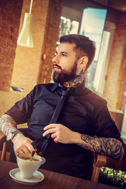 Bearded man with tattoos - Фото, изображение