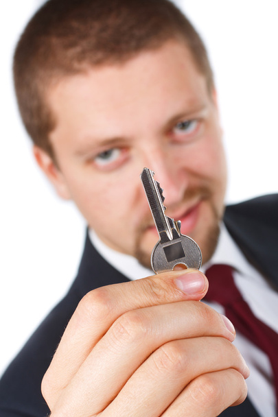 Empresario sosteniendo una llave
 - Foto, Imagen