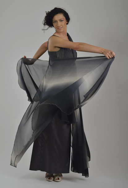 Elegant woman in fashionable dress posing in the studio - Zdjęcie, obraz
