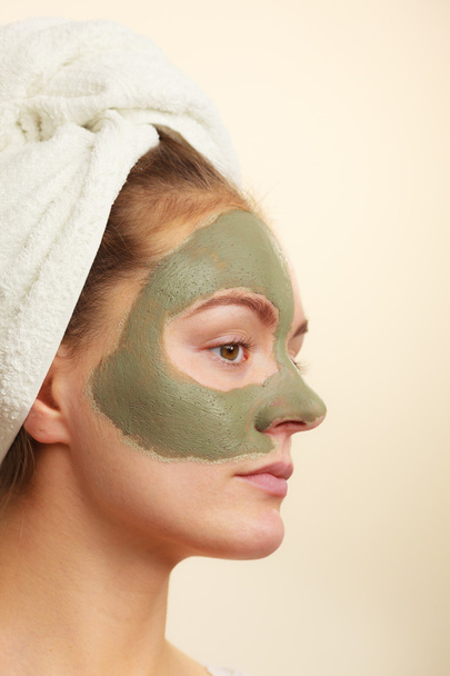 Woman  with green clay mud mask - Fotoğraf, Görsel