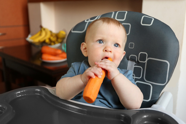 Baby eating carrot - Fotó, kép